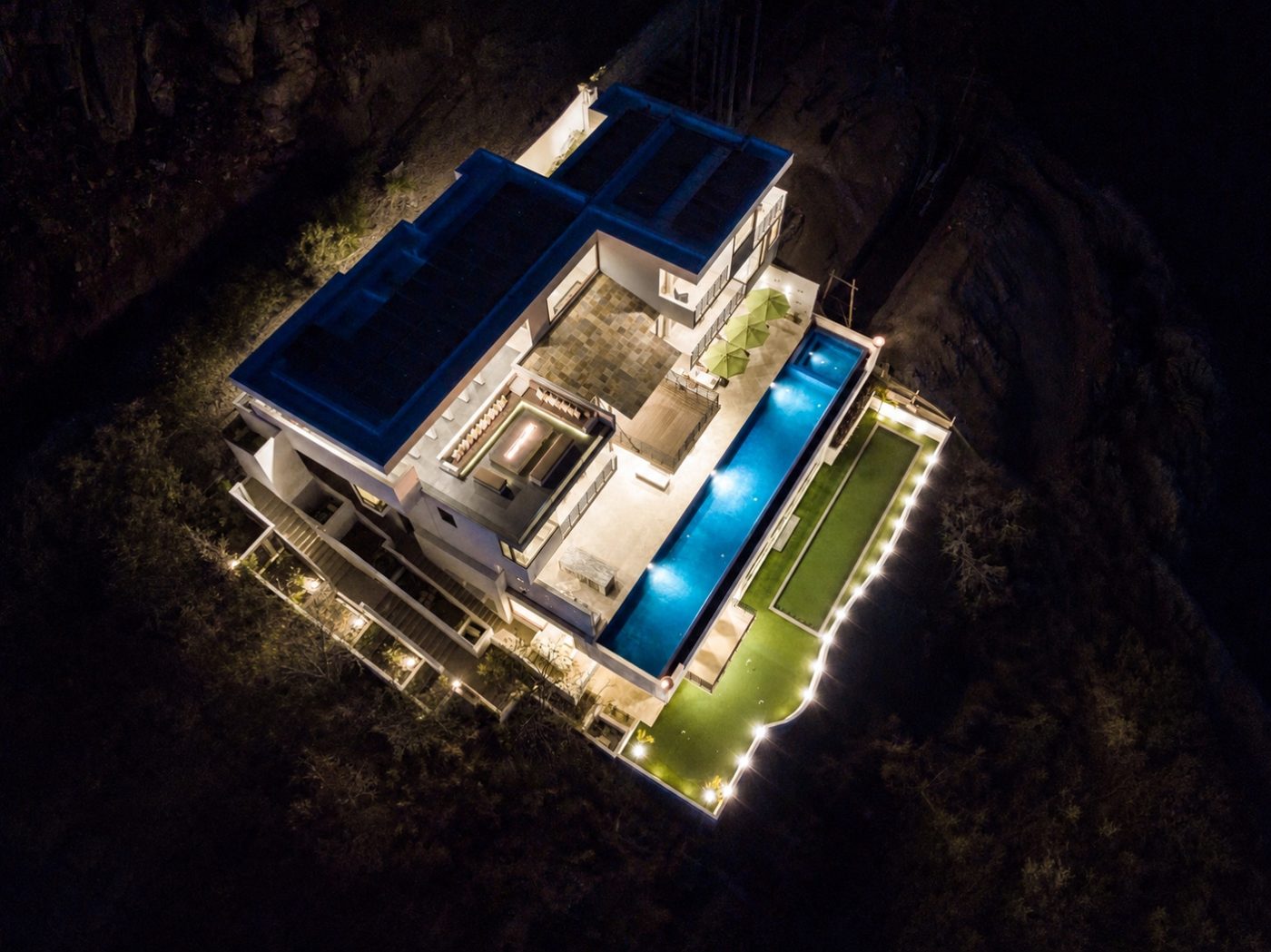 Aerial view of Villa Savina with infinity pool and bay beyond