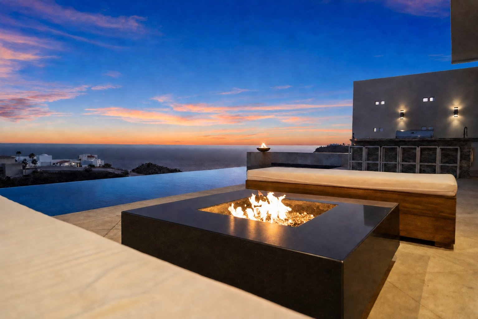 Pool deck with chaise lounges overlooking the ocean